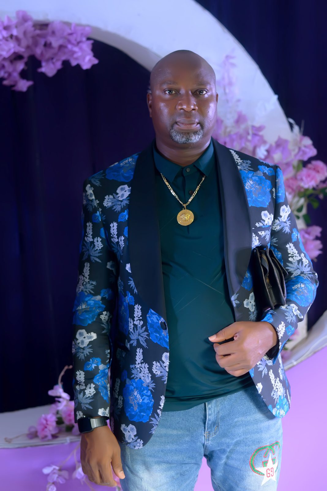 A guest in a floral dinner jacket