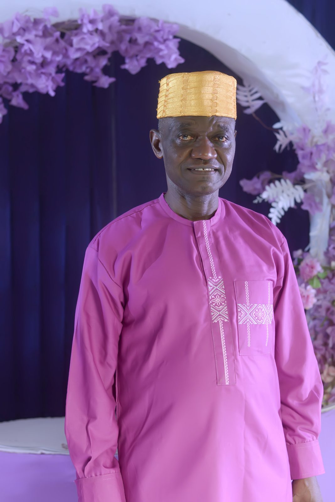 A guest in a rose-pink outfit